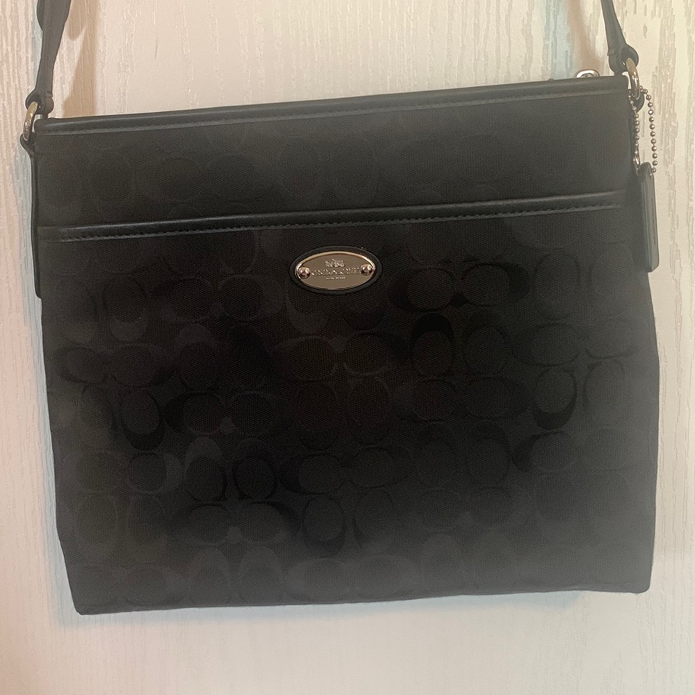 Coach fabric not leather crossbody purse. Black and in new condition.